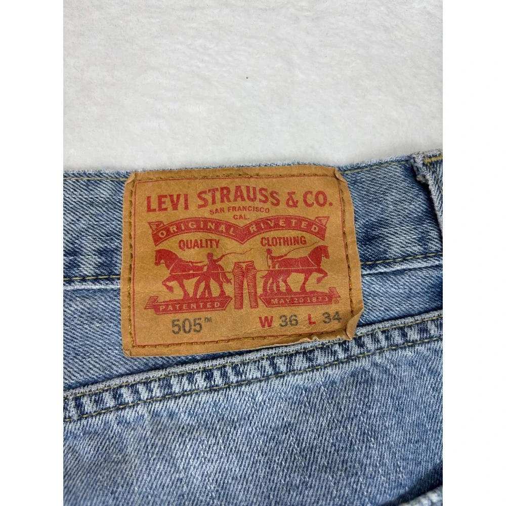 Levis 505 Mens 36x34 Jeans Light Blue Wash Denim Grungy HighLow Fade ripped Hem